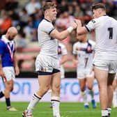 Harry Newman - seen on the left, with Jack Welsby - picked up a "knock" playing for England last week, but is available for Leeds Rhinos' Saturday showdown against London Broncos, interim-coach Chev Walker says. Picture by Alex Whitehead/SWpix.com.