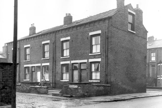 The rear of four terraced houses on Back Ascot Place including small back yards where washing lines are hanging. Visible on the right is Ascot Place. Pictured in October 1966.