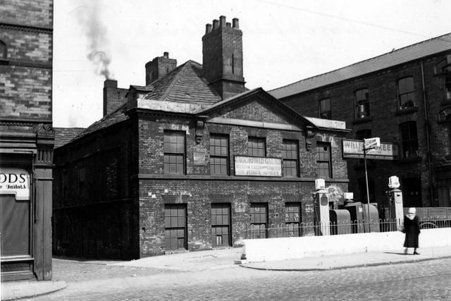 Brookfield Garage on Hunslet Road owned by William Green pictured in June 1949. It has petrol pumps in front of the building. The corner of Greenwood's clothiers, at 165-167 Hunslet Road is on the left. Brookfields Garage was formerly Ingram's House.