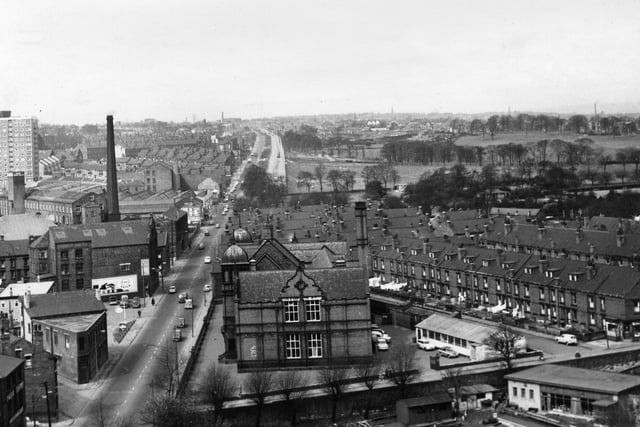 This photo looks up Stanningley Road with Cecil Road in the foreground leading off to the right. Beech View is on the left, then the Esso garage and the chimney of Winker Green Mill. Armley Park School is in the centre with the bowling green of Armley Liberal Club in the foreground. Further back are the streets of the Cecils on the right and the Hopes behind the school, then Armley Park and Gotts Park in the background.