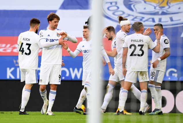 Patrick Bamford of Leeds United celebrates with teammates after scoring his side's second goal during the Premier League against Leicester City.