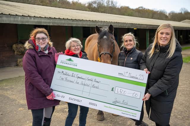 B&DWW - SGB-62203 - Georgina handing the cheque to Middleton Park Equestrian Centre