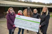 B&DWW - SGB-62203 - Georgina handing the cheque to Middleton Park Equestrian Centre