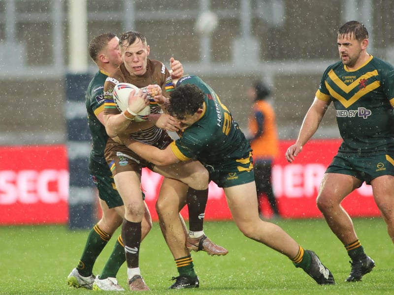 Hunslet ARLFC's Tommy Corke battles the heavy rain and West Hull defence during the National League Premier Division Grand Final.