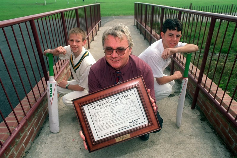 Australian exchange teacher, Dave Swann, holds his certificate signed by cricket legend Don Bradman at Farnley Park High School in September 1998. He is pictured with pupils Warren Brewer (left) and Andrew Punter.
