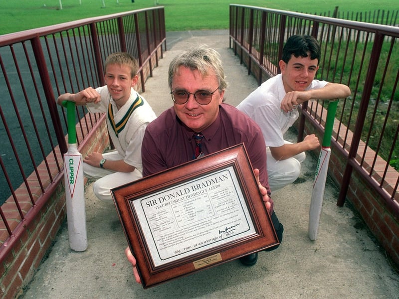 Australian exchange teacher, Dave Swann, holds his certificate signed by cricket legend Don Bradman at Farnley Park High School in September 1998. He is pictured with pupils Warren Brewer (left) and Andrew Punter.