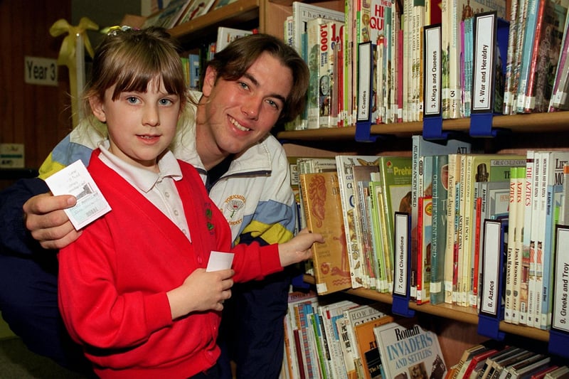 Yorkshire CCC star Chris Silverwood, a former pupil of Gibson Lane Junior School in Kippax, opened the new computerised library in October 1996. He is pictured with pupil Catherine Baker.