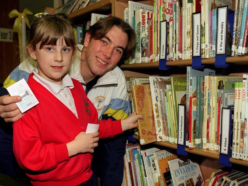 Yorkshire CCC star Chris Silverwood, a former pupil of Gibson Lane Junior School, opened the new computerised library in October 1996. He is pictured with pupil Catherine Baker.