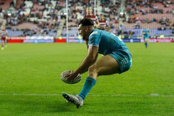 Liam Tindall scores for Rhinos in this season's win at Wigan. Picture by Ed Sykes/SWpix.com.