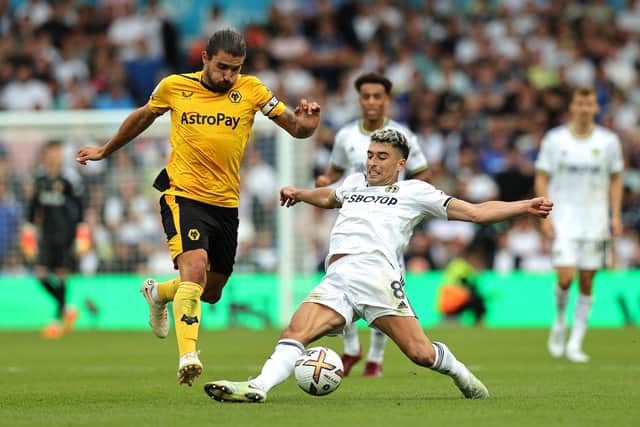 Ruben Neves of Wolverhampton Wanderers is tackled by Marc Roca of Leeds United  during the Premier League match between Leeds United and Wolverhampton Wanderers at Elland Road (Photo by David Rogers/Getty Images)