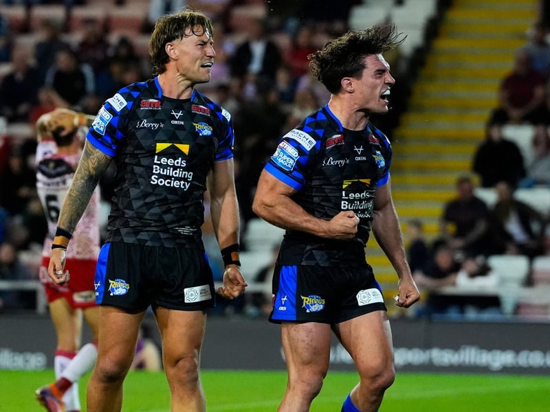 Brodie Croft, right, celebrates with debutant Chris Hankinson after Rhinos hit back from 8-0 down to win 22-14 at Leigh Leopards in August.