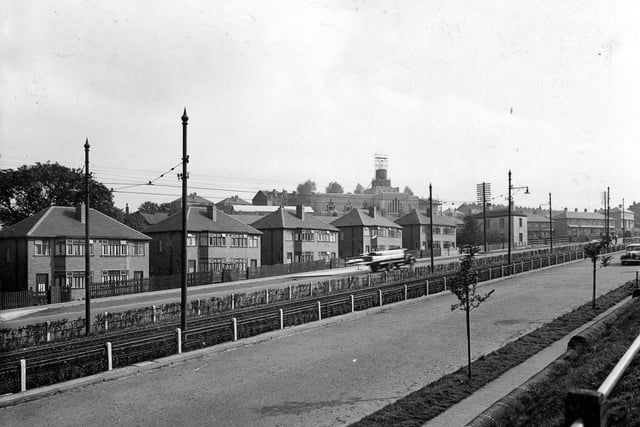A  view across Selby Road with tramlines running between each carriageway in September 1938. In the background is St. Wilfrids Church with scaffolding on the tower.