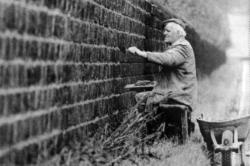Colin Hartley pictured repointing the wall around Harewood House in October 1990.