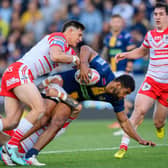 Kallum Watkins is tackled by St Helens' Shane Wright during Leeds Rhinos' 24-16 win last week. Picture by Allan McKenzie/SWpix.com.