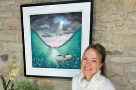 Artist Lucy Pittaway with her new artwork Tree of Hope.