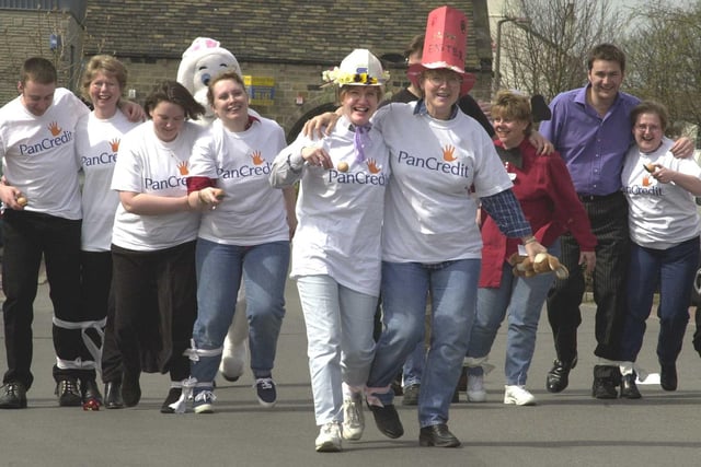 Employees of PanCredit took part in a Easter three legged egg and spoon race to raise funds for charities, including the baby care unit at Huddersfield hospital. Pictured in April 2001, centre, are Hazel Smith, left, and Janet Bainbridge.