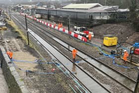 Teams from Network Rail were urgently trying to clear the waterlogged lines in Kirkstall on December 2 after a night of heavy rain.