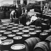 The 'clean barrel' room - where the empty barrels after being returned from the pubs are cleaned for use again  - at Tadcaster Brewery in July 1963.