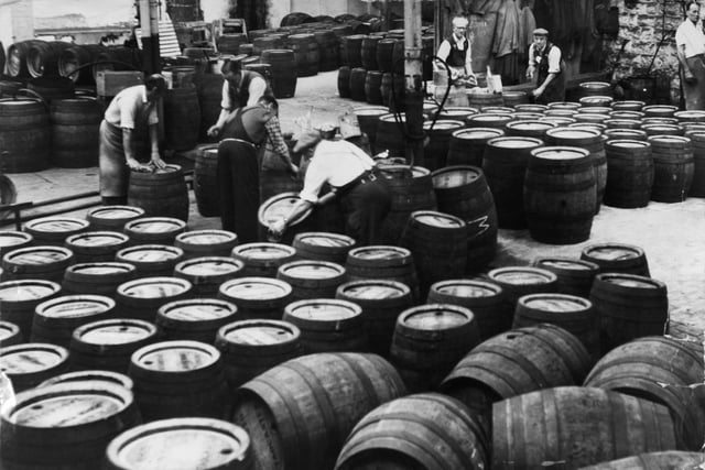 The 'clean barrel' room - where the empty barrels after being returned from the pubs are cleaned for use again  - at Tadcaster Brewery in July 1963.