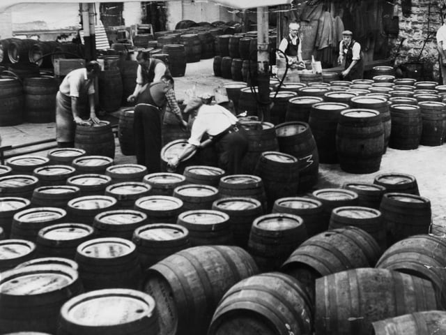 The 'clean barrel' room - where the empty barrels after being returned from the pubs are cleaned for use again  - at Tadcaster Brewery in July 1963.