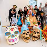 Artist Ellie Harrison (centre) and artists from Zion Art Studios at Leeds Playhouse ahead of 'All That Lives' festival, in honour of Day of the Dead. Photo: Jemma Mickleburgh