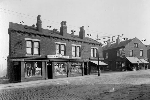 York Road in September 1935. From the left is the junction with Greyhound Place, Owen and Robinson, pawnbroker and supplier of household goods is at no.113 York Road. Next right, no.115 Fred Walker, grocer. Harry Jordan has window of fruit and vegetables at no.117 with slogan across window 'Always the best, at market prices'. No.119 is H.Burgon and son, butcher. The entrance to Greyhound Street with Thomas Carkers shop at 121 on the right. Poster for 'OXO' on the wall. The numbers on the photograph are not for the properties.