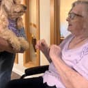 Resident at HC-One’s Augustus Court Care Home with dog, Honey