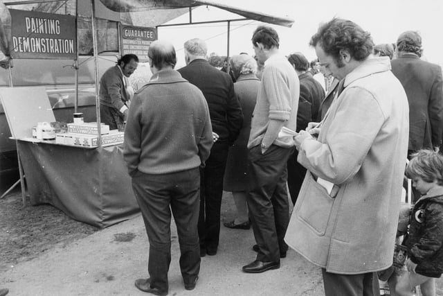 A weights and measures inspector takes notes at one of the stalls at the open market at Melbourne Airfield in June 1973.