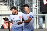 SINSHEIM, GERMANY - OCTOBER 21: Ellyes Skhiri of Eintracht Frankfurt celebrates with Robin Koch of Eintracht Frankfurt after scoring the team's third goal during the Bundesliga match between TSG Hoffenheim and Eintracht Frankfurt at PreZero-Arena on October 21, 2023 in Sinsheim, Germany. (Photo by Markus Gilliar/Getty Images)
