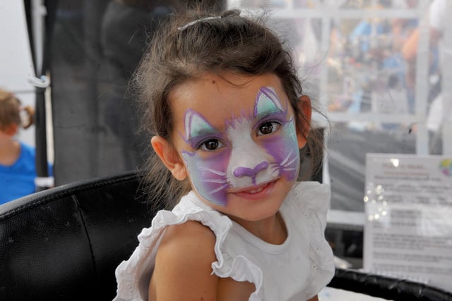 Betsy Allen, aged three, enjoying having her face painted