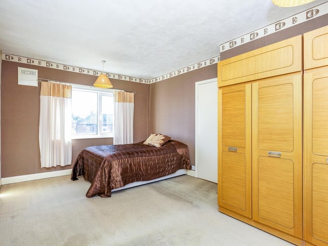 To the first floor are the two bedrooms and a bathroom with an electric shower.