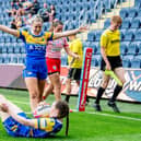 Liv Whitehead (standing) celebrates a try by Sophie Nuttall in Leeds Rhinos' home win against Leigh Leopards last month. Picture by Allan McKenzie/SWpix.com.