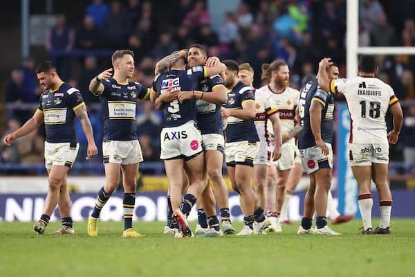 Rhinos celebrate their one-point win over Huddersfield at Easter. Picture by John Clifton/SWpix.com.