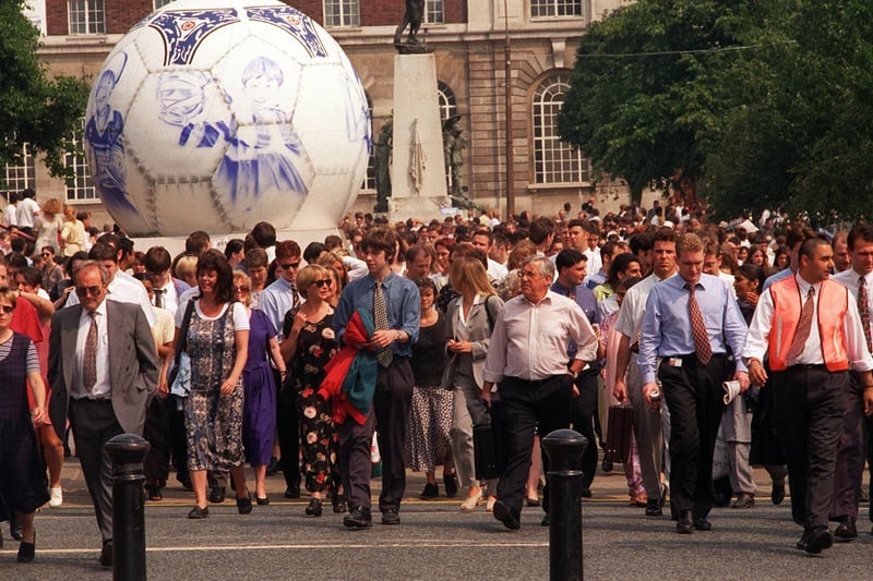 Officer workers and shoppers pour out The Headrow after police ordered an evacuation of the city centre in July 1996.