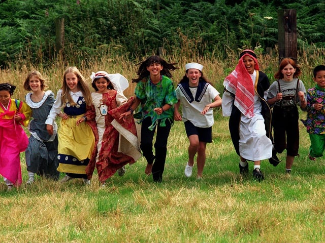 Children from The Eastmoor Centre in Adel prepare for a song and dance performance at The Leeds Show in August 1996. The children are all from different nations and are dressed in their countries traditional clothes. Pictured, in no order, are Anna Piccionlini (Italy), Miguel Vargas (The Philippines), Shia Hong (South Korea), Humam Haddadin (Jordan), Helena Holmquist, (Sweden), Maaiken Hubmann (Austria), Amy Wiles (GB), Jenna Krummingu (USA and Karen Frederiksen (Argentina).