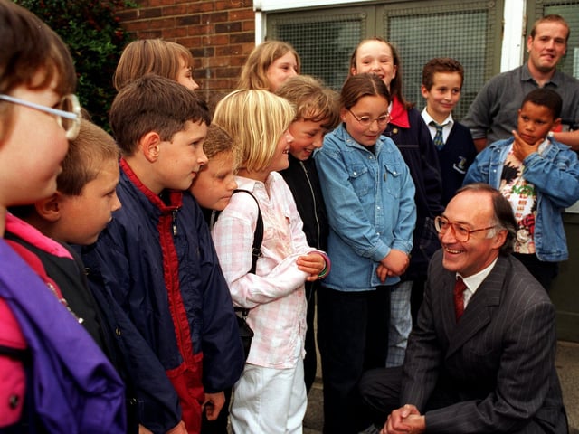 Home Secretary Michael Howard talks with members of an eight-to-13-year-old after school group at the Seacroft Project Base during his visit to the Seacroft estate in September 1996.