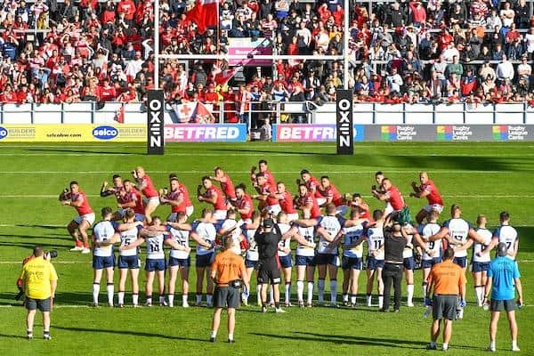 England watch as Tonga perform their pre-match Tonga performing the Sipi Tau. Picture by Olly Hassell/SWpix.com.