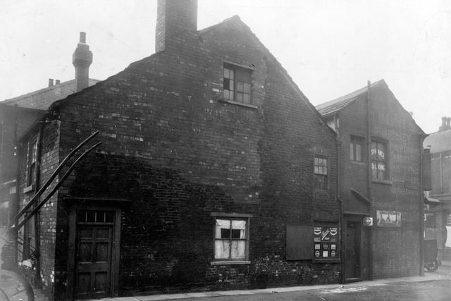 Off Spence Lane, junction with Wortley Lane in October 1929. Listed as number 3 Wortley Lane and rear of premises in Barratt Fold, G. Clarkson Ltd, chemists. Advertisements on the window include 'Dr.J. Collis Browns Chlorodyne' patent medicine, Aspro, Halls distemper (equivalent now would be emulsion paint).