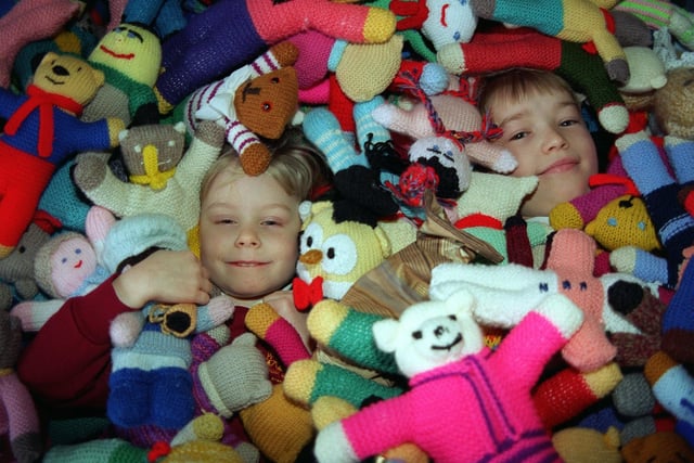 Children at Archbishop Cranmer Primary School helped make hundreds of teaddy bears for charity in January 1997. Pictured are pupils Amberzine Bolton and Michael Spink.