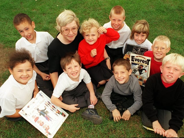Headteacher Ann Tomkins pictured with pupils at Clapgate Primary School in September 1999 who did not miss a days attendance during all the last school year  and were rewarded with tokens for books.