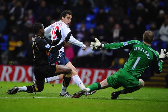 MAKING HIS WAY: A 19-year-old Rodrigo scores for Bolton Wanderers in the Premier League clash at home to Wigan Athletic of January 2011.
Photo by Clive Mason/Getty Images.