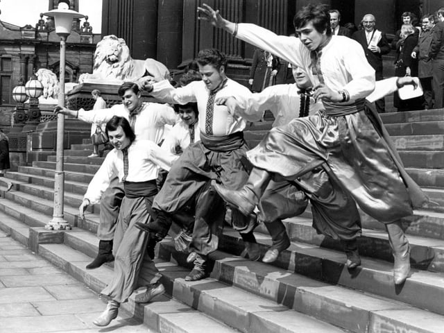 Ukrainian dancers on the steps of Leeds Town Hall in April 1971. The Red Army ensemble were performing at the Grand Theatre but had just been charged on this day, with disorderly conduct.