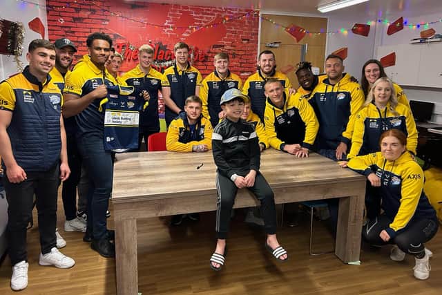 Young fan Vinny had an early Christmas surprise when he met  Rhinos men's and women's players during their annual visit to Leeds Children's Hospital. Picture by Leeds Rhinos/Leeds Teaching Hospitals NHS Trust.