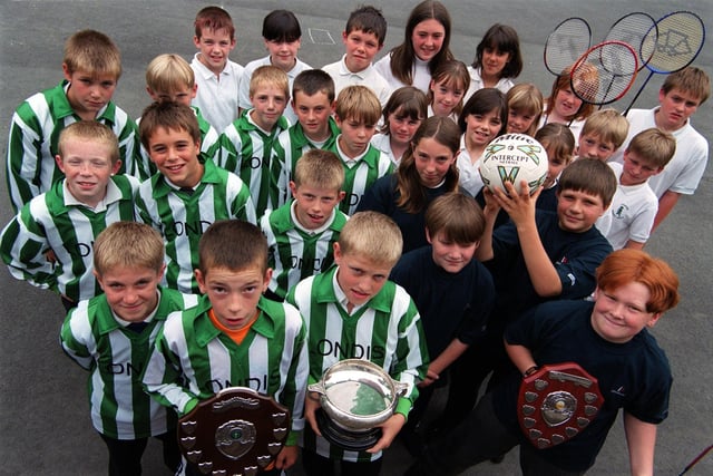 Pupils from Greenhill School are pictured in July 1999 having had an excellent sporting year, winning trophies for football, netball, badminton, and athletics.