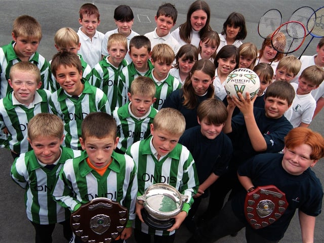 Pupils from Greenhill School are pictured in July 1999 having had an excellent sporting year, winning trophies for football, netball, badminton, and athletics.