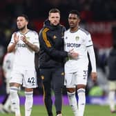 FIGHTIING ON: Whites captain Liam Cooper, centre, with Junior Firpo, right, and Sam Greenwood, left, after Wednesday night's 2-2 draw against Manchester United at Old Trafford. Photo by Naomi Baker/Getty Images.