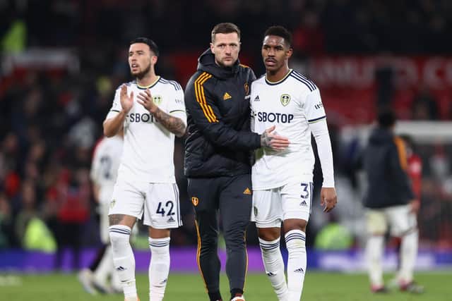 FIGHTIING ON: Whites captain Liam Cooper, centre, with Junior Firpo, right, and Sam Greenwood, left, after Wednesday night's 2-2 draw against Manchester United at Old Trafford. Photo by Naomi Baker/Getty Images.