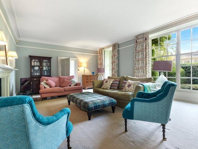 Either side of the hallway are two reception rooms, with floor to ceiling Georgian sash windows and original shutters.