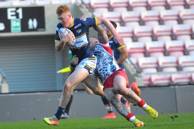 Rhinos' new signing Luis Roberts goes over for a try against his former club Leigh. Picture by Steve Riding.