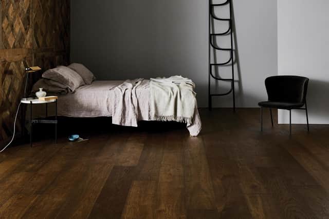 Dark wood flooring is finally making a comeback too this year, as in this Salcey design
